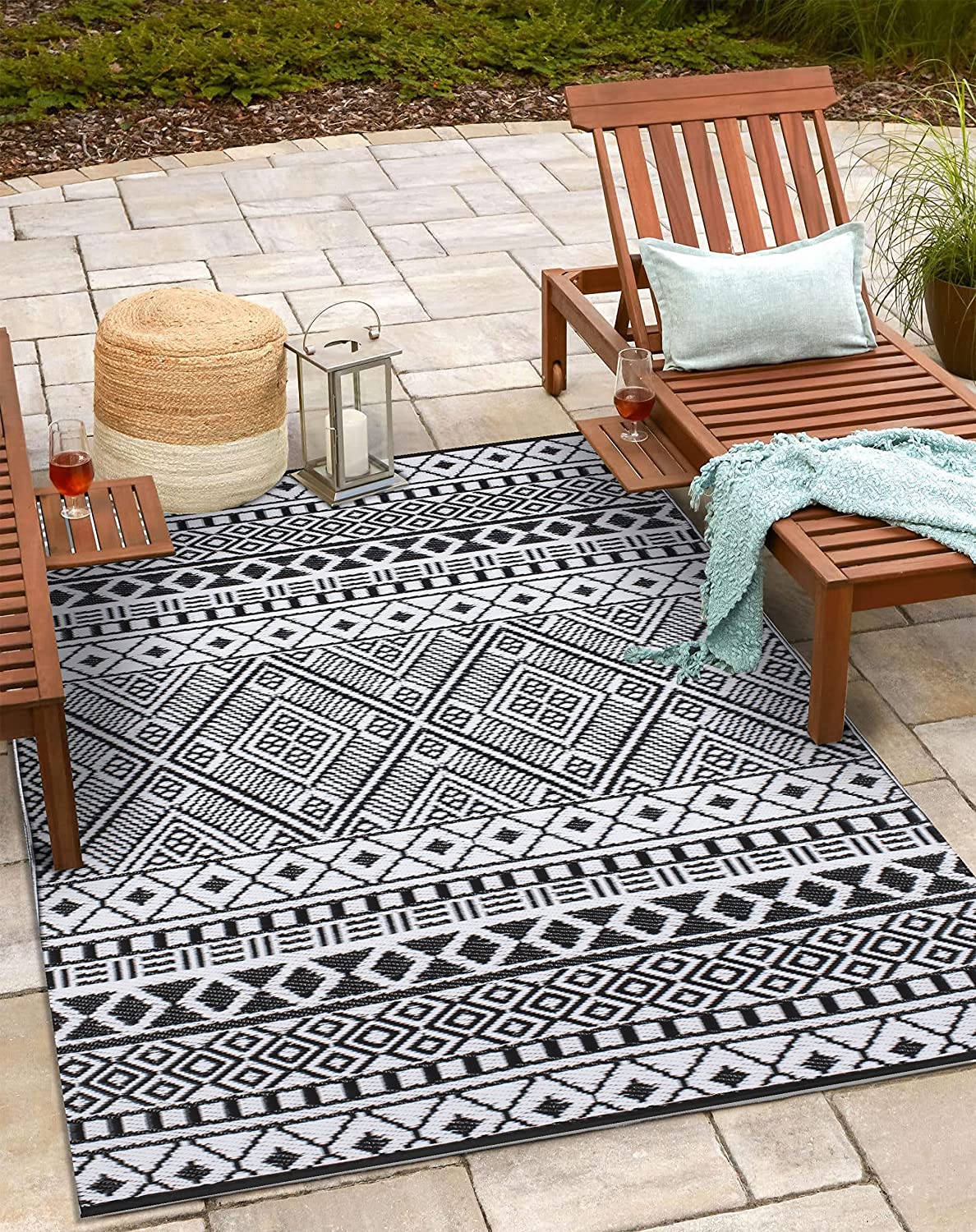 Stain Proof Rain Proof Lightweight Reversible Plastic Outdoor Rug (6x9, Black/White) - $45