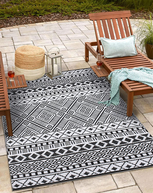 Stain Proof Rain Proof Lightweight Reversible Plastic Outdoor Rug (6x9, Black/White) - $45